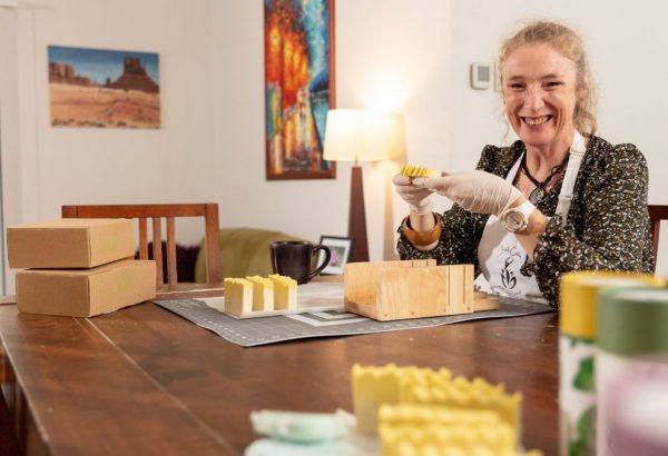 Caroline Woodman hand-making products for BathCalm, her home-based business in Yarrabilba.