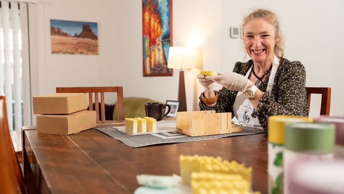 Caroline Woodman hand-making products for BathCalm, her home-based business in Yarrabilba.
