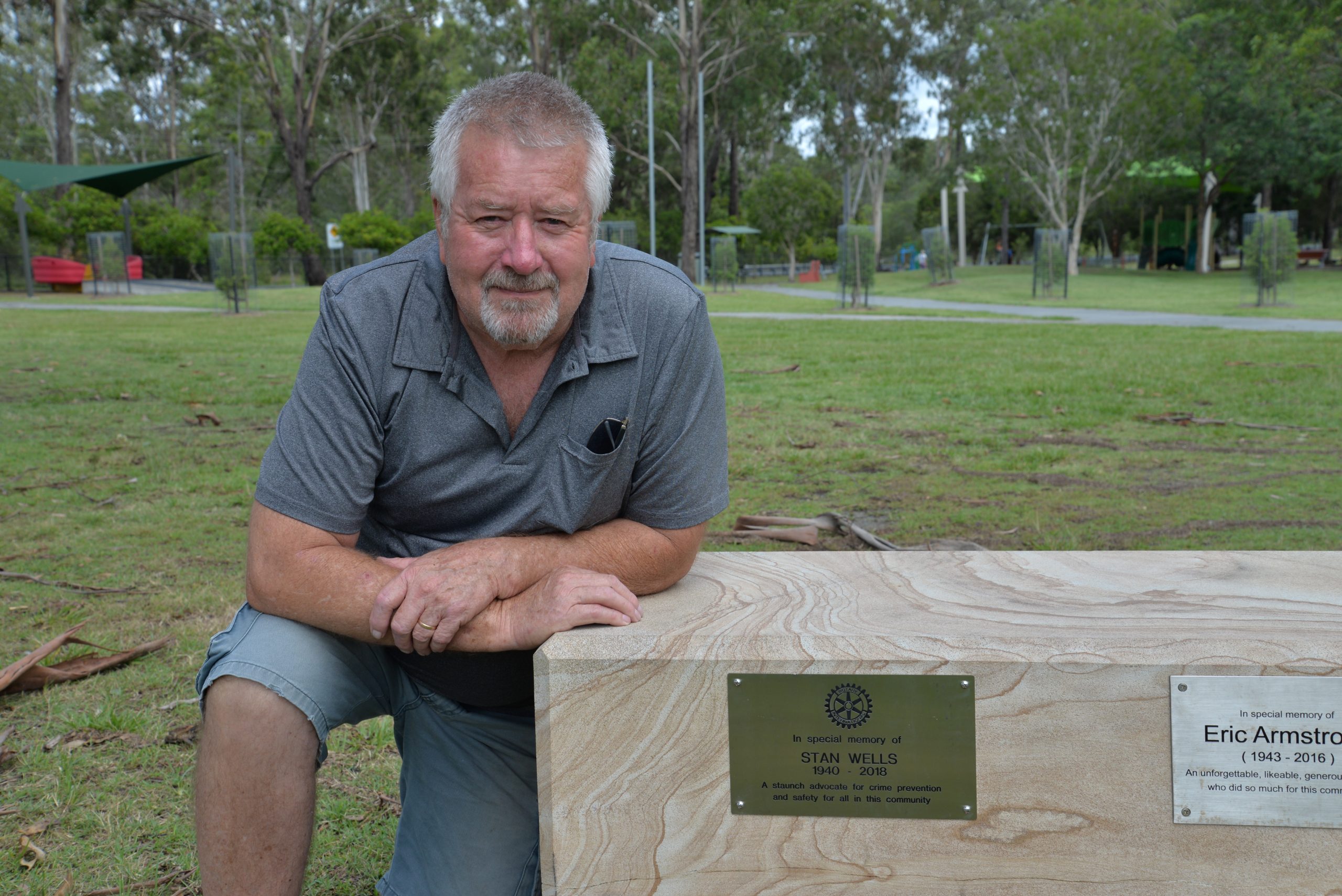 Bob Wiley in Rotary Park with the plaque for Stan Wells