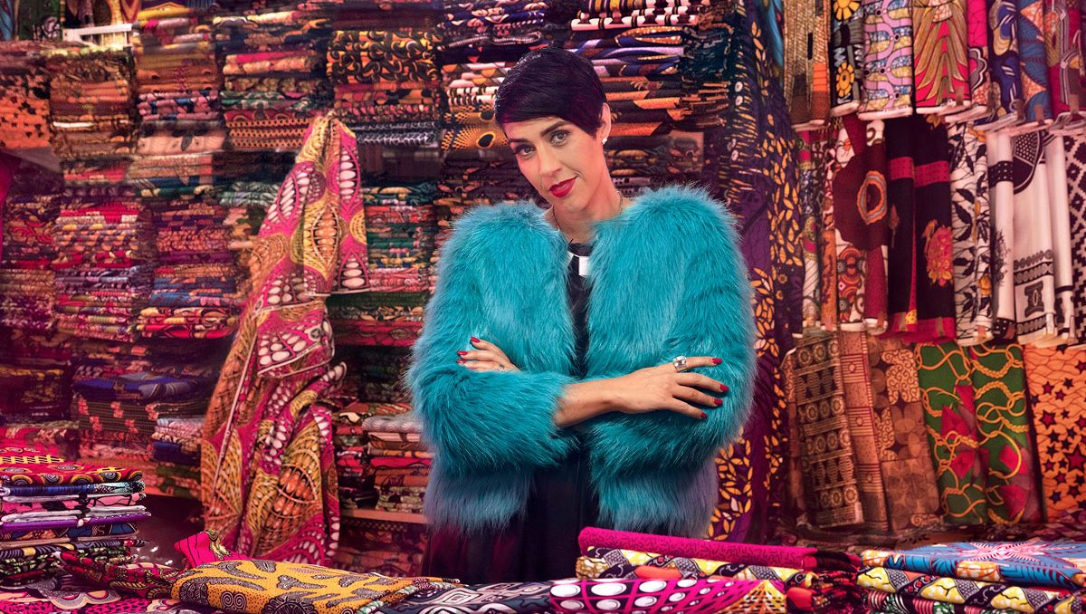 Emma Willmann on Proud City shoot in a colourful fabric store