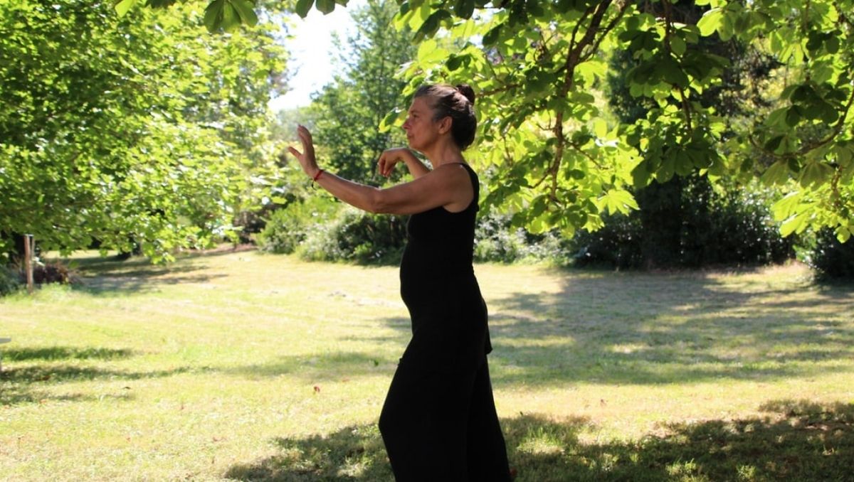 Woman practicing Tai Chi outdoors