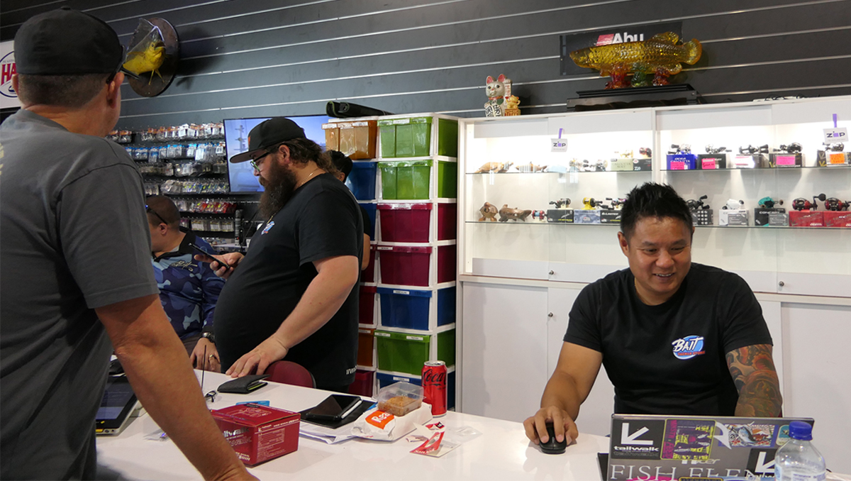 Ivan Lee and his boys enjoying a chat at the register in the Bait Tackle Store.