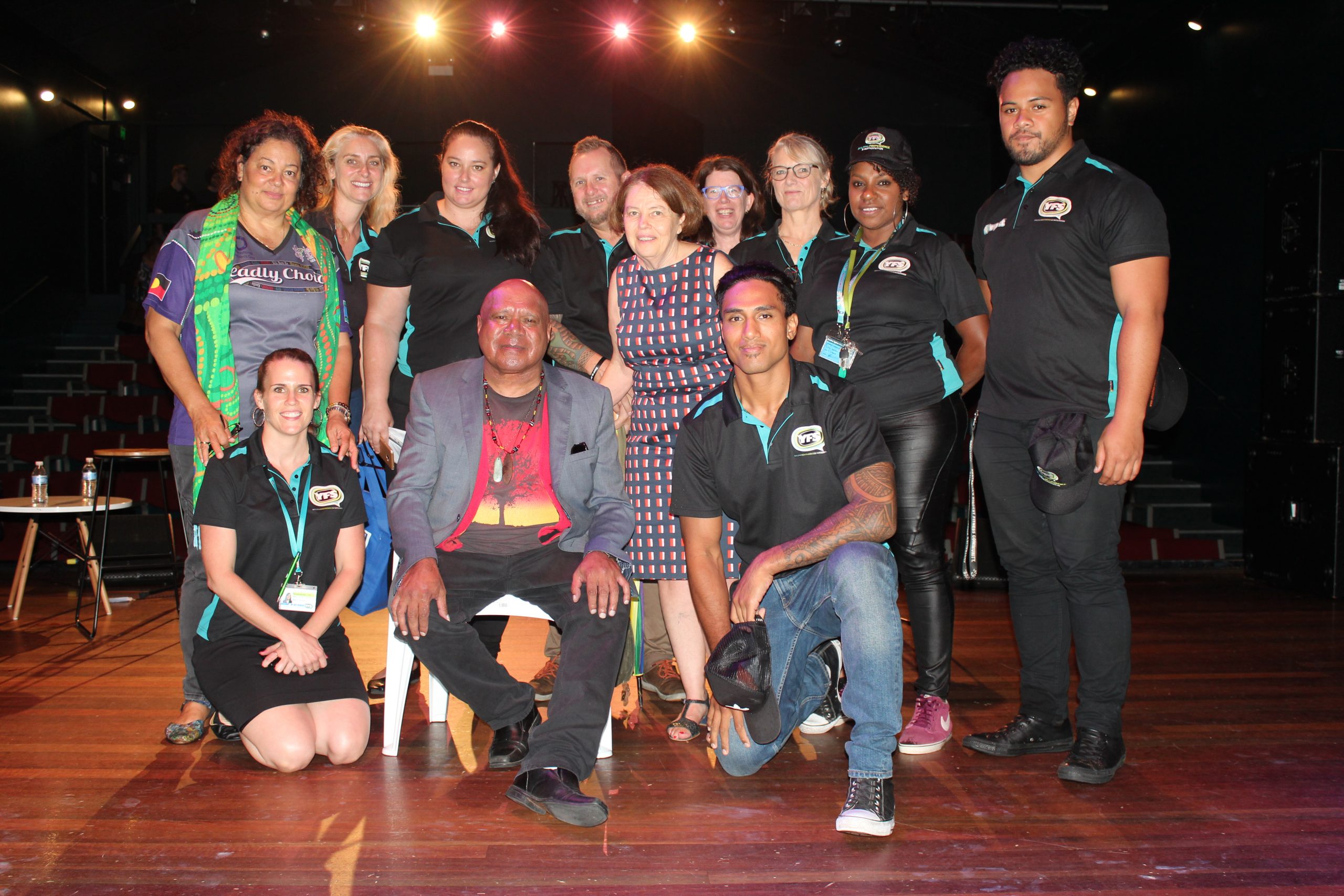 Apology event with Archie Roach. Group of people, including Cath Bartolo, with Archie Roach
