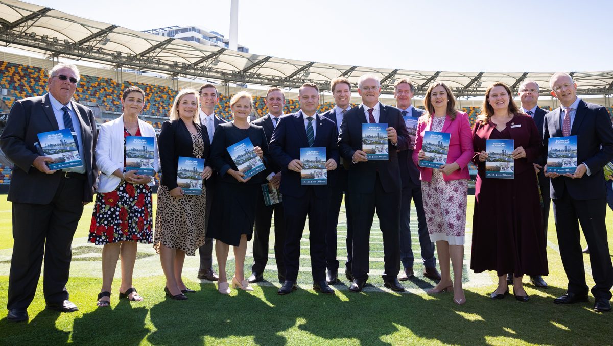 A photograph of representatives from the Morrison and Palaszczuk Governments, and the Council of Mayors at the signing of the SEQ City Deal.