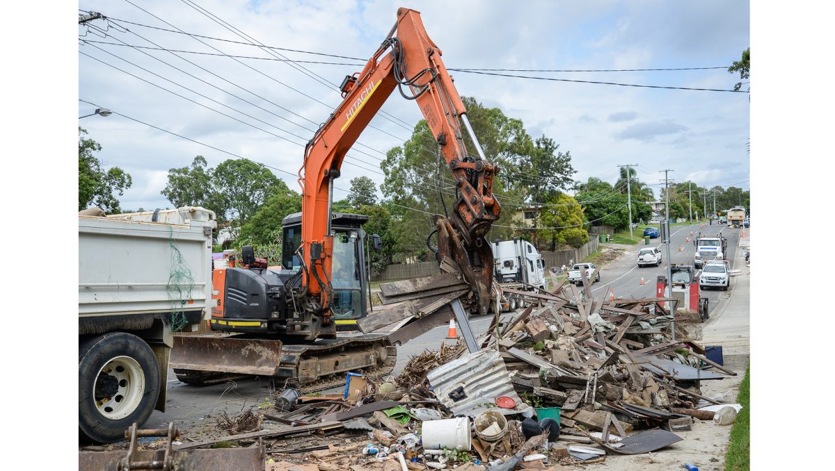 A photograph of kerbside clean-up efforts on a City of Logan street.