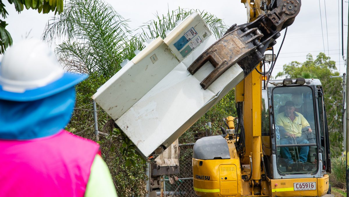 A photograph of kerbside clean-up efforts on a City of Logan street.