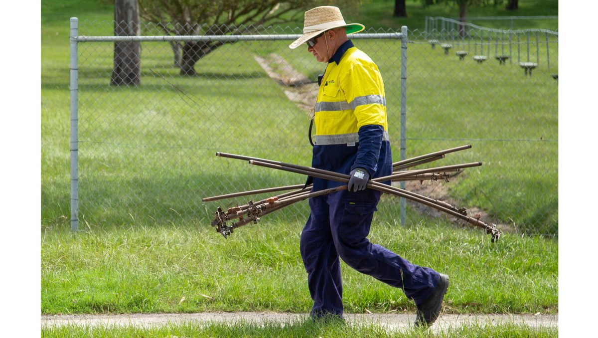 A photograph of kerbside clean-up efforts on a City of Logan street.