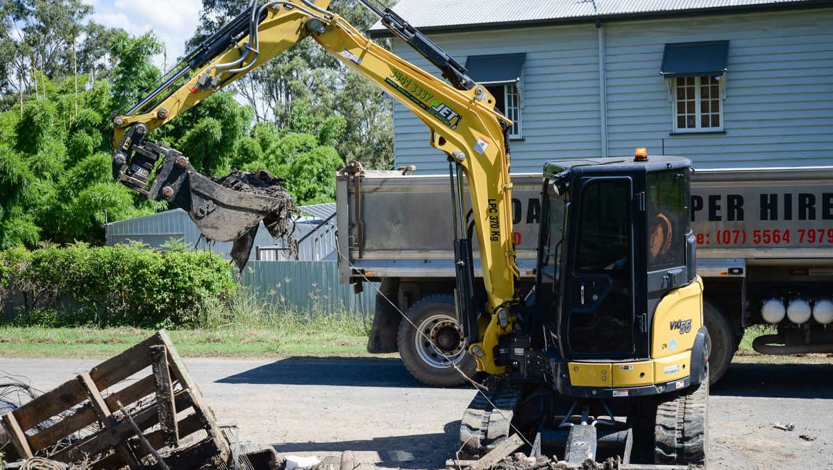 bobcat cleans up rubbish