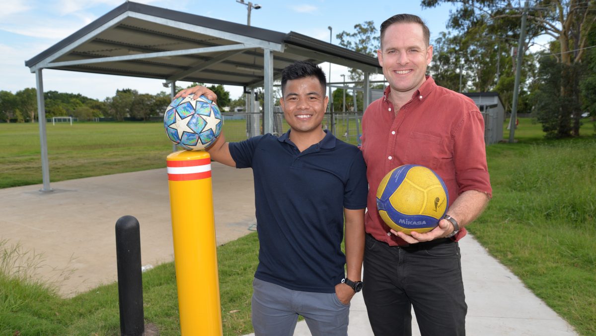 Deputy Mayor Jon Raven (right) with Matu Community of Queensland president Lal Ram Nghet at the new entry to Melissa Street Oval.