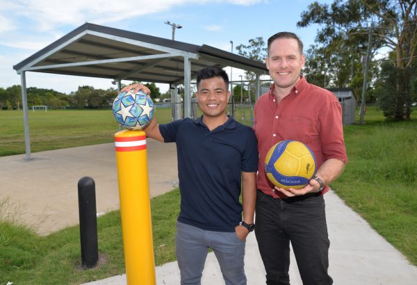 Deputy Mayor Jon Raven (right) with Matu Community of Queensland president Lal Ram Nghet at the new entry to Melissa Street Oval.
