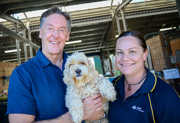Logan Mayor Darren Power and Council officer Donna Lange with Missy the Maltese X.