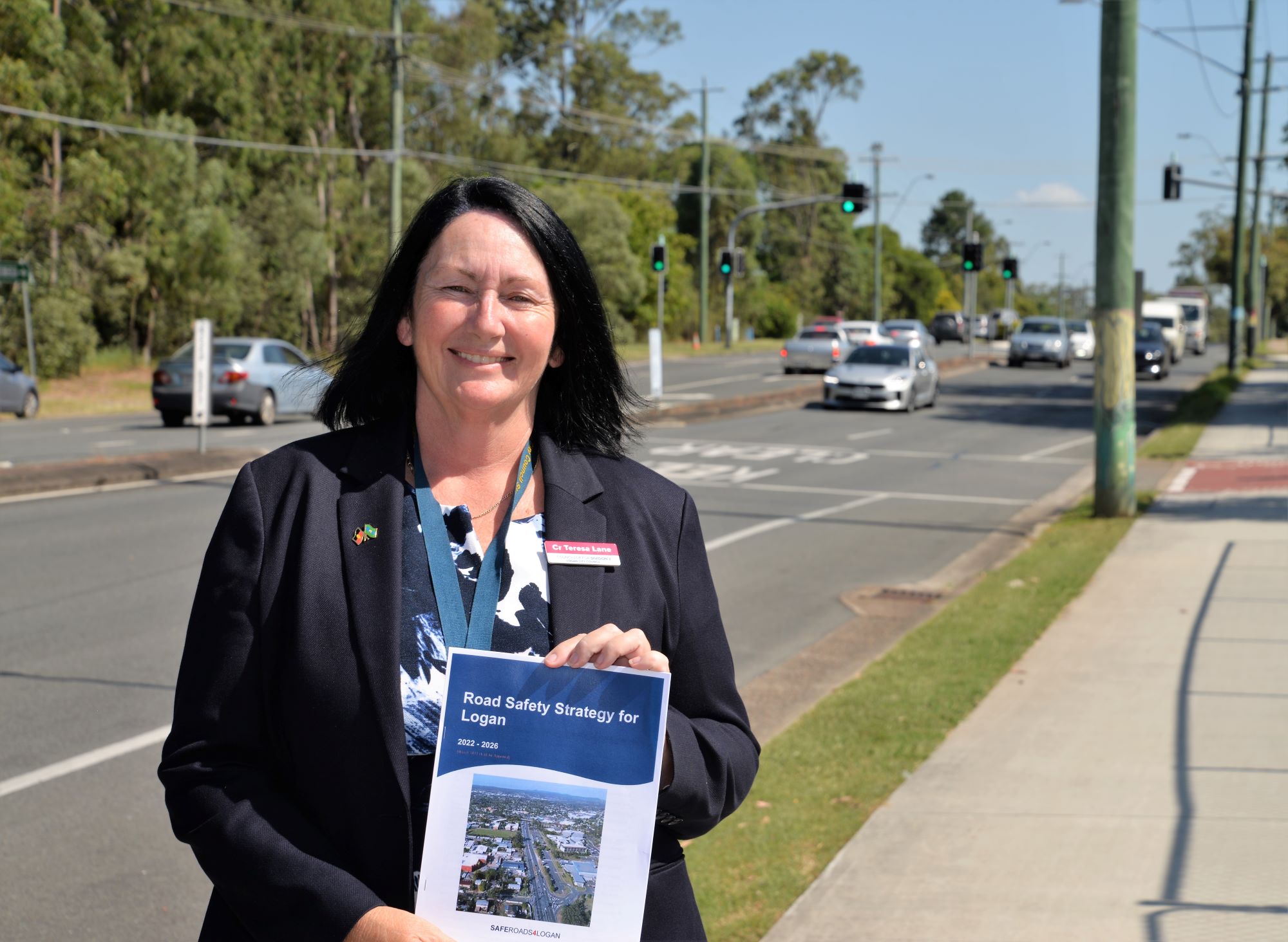Logan City Council Infrastructure Chair Councillor Teresa Lane with the SafeRoads4Logan Road Safety Strategy 2022-26.