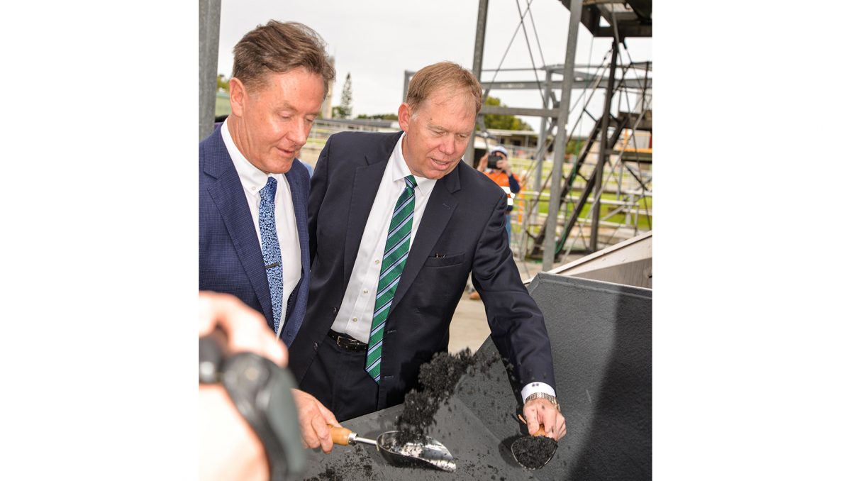 City of Logan Mayor Darren Power and Federal Member for Forde Bert van Manen examine the biochar.