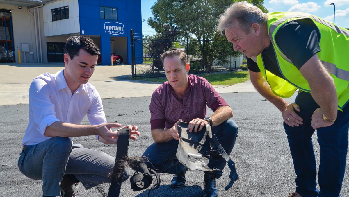 (from left) Hooning Taskforce Chair Councillor Jacob Heremaia, Deputy Mayor and Division 5 Councillor Jon Raven and Pinnacle Hardware operations manager John Chesser examine rubber left on the road after recent hooning activity in Berrinba.