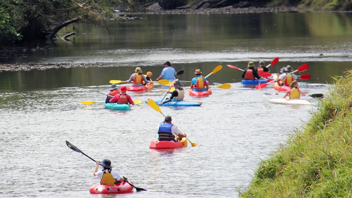 And image of kids kayaking on the Logan River to demonstrate that kayaking, canoeing and camping are activities perfectly suited to nature-based tourism in the City of Logan.