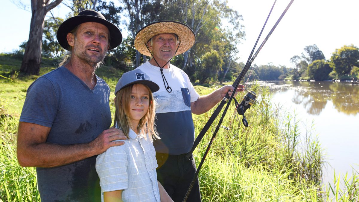 An image of keen fishermen (from left) Glen, Keale and Eric Sprudzans, of Logan Village, with rods on the side of the river to show that they already appreciate the recreational value of City of Logan waterways which is a key part of the new nature-based tourism strategy.