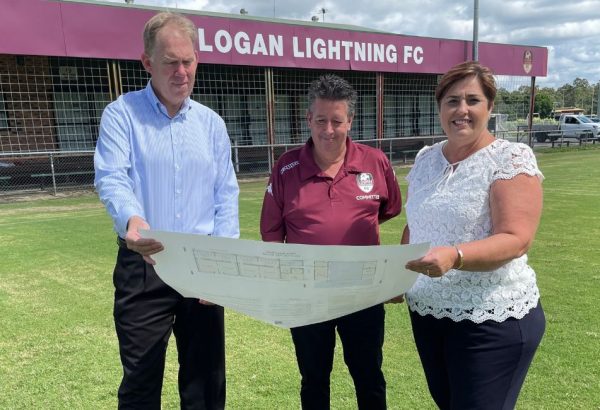 Cr Karen Murphy and Bert van Manen check out plans for Logan Lightning FC