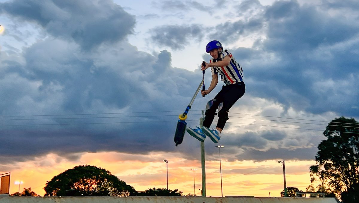 An image of Jake Mitchell, of Holmview, doing a scooter jump at Beenleigh's Doug Larsen Park.