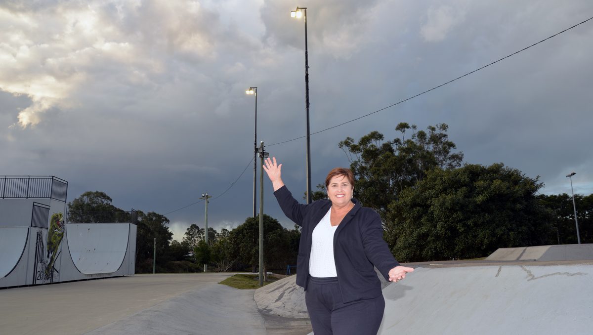 An image of Division 12 Councillor Karen Murphy standing under the new lights at Doug Larsen Park in Beenleigh.