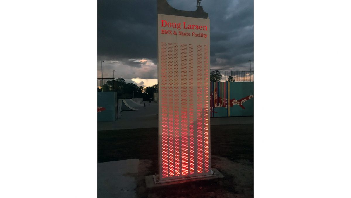 An image of a new illuminated red sign for Doug Larsen Park which is also part of the upgrade.