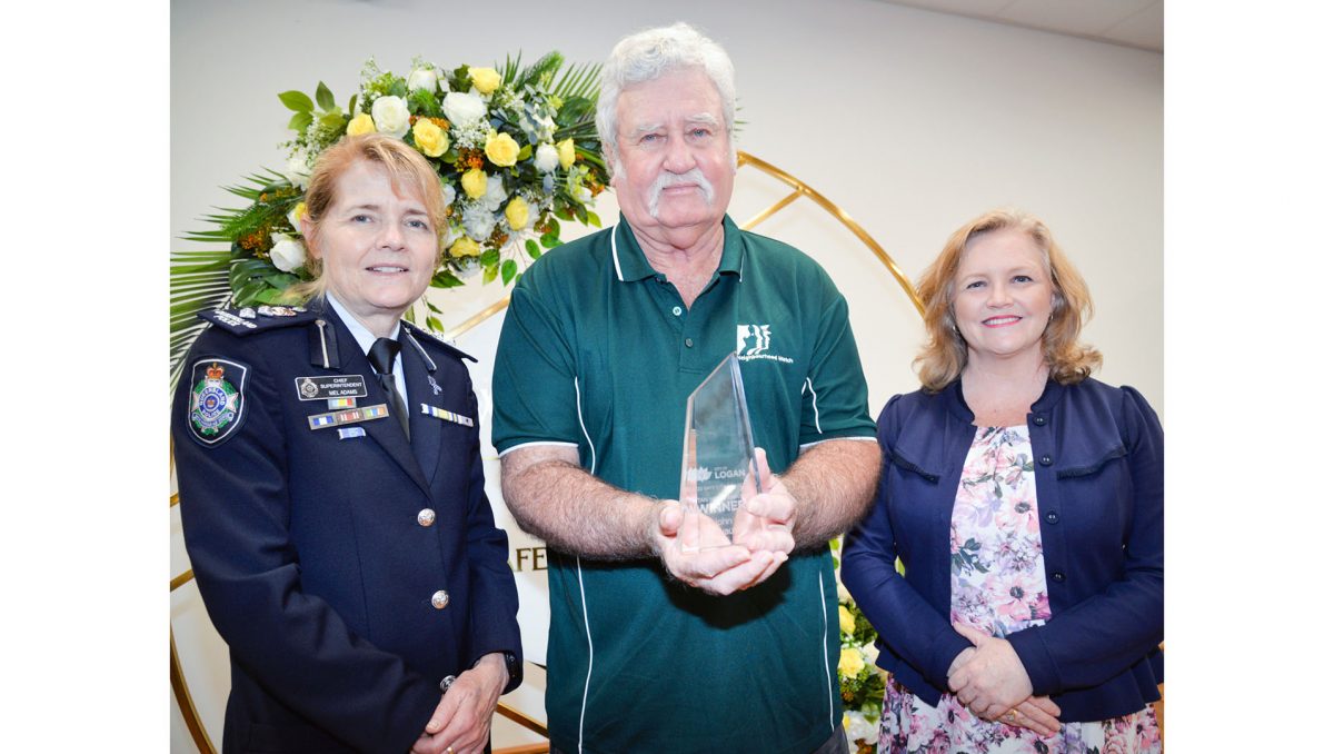 Logan District Chief Superintendent Mel Adams (left) and City Lifestyle Chair, Councillor Laurie Koranski congratulate John Devaus on his win at the annual City of Logan Safe City Awards.