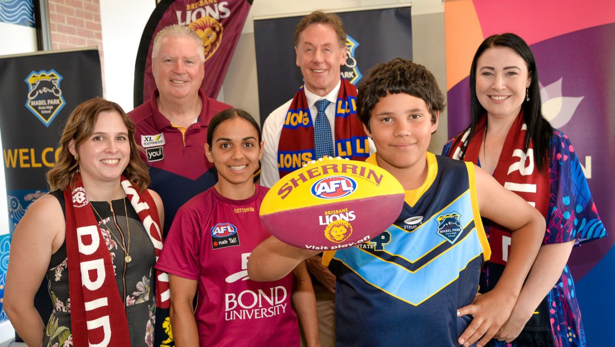 City of Logan Mayor Darren Power (centre back) and Division 3 Councillor Mindy Russell (back right) with Mabel Park State High School principal Aimee Agiro, Brisbane Lions CEO Greg Swann, Brisbane Lions AFLW star Courtney Hodder and Mabel Park State High School student Geremy Kickett.