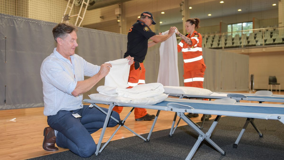 Mayor Darren Power helps at an evacuation centre during the March 2022 floods.