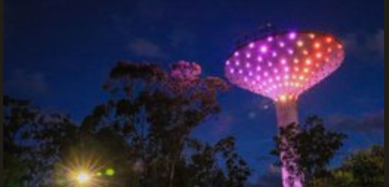 Wineglass water tower at night