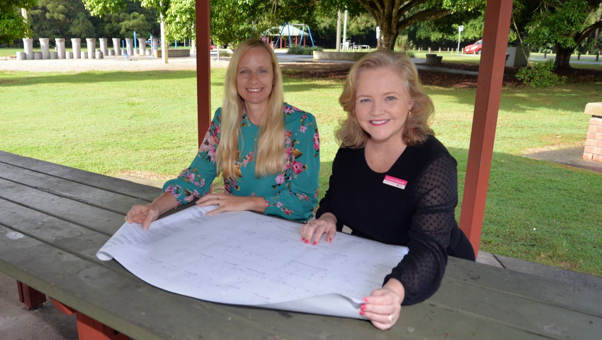 An image of Cr Laurie Koranski (right) and Cr Miriam Stemp reviewing plans for the upgrade of Alexander Clark Park in Loganholme.