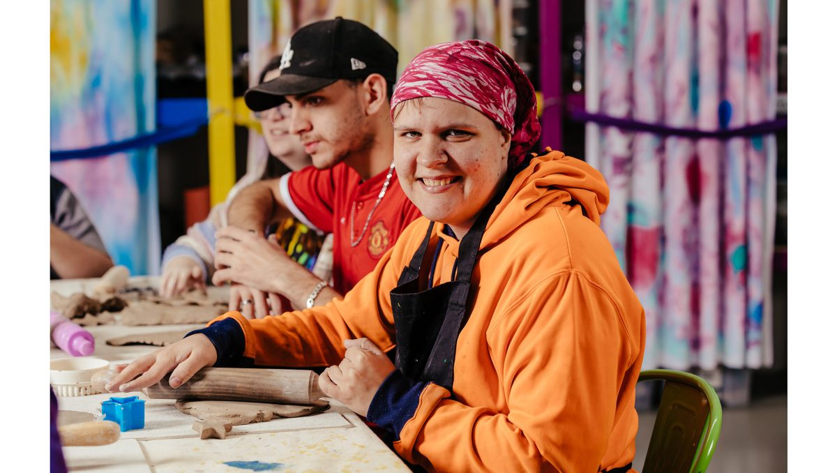 Neta, Khaled and Ellen enjoy a pottery program at First Service Inc which is an organisation which Logan City Council works closely with.