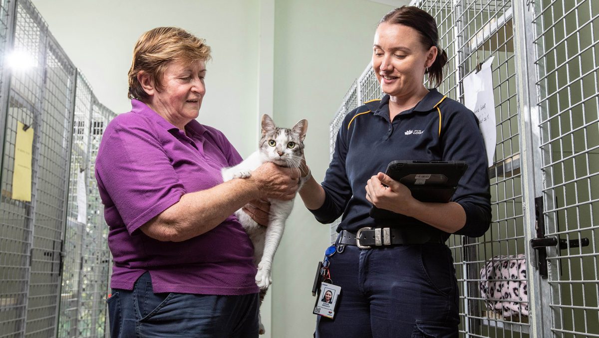 Logan City Council Animal Management Officer Dana Wright (right) with Jimboomba Pet Motel owner Renee Luckman and fluffy friend Kirra ahead of the release of the City of Logan’s Animal Management Plan 2023.