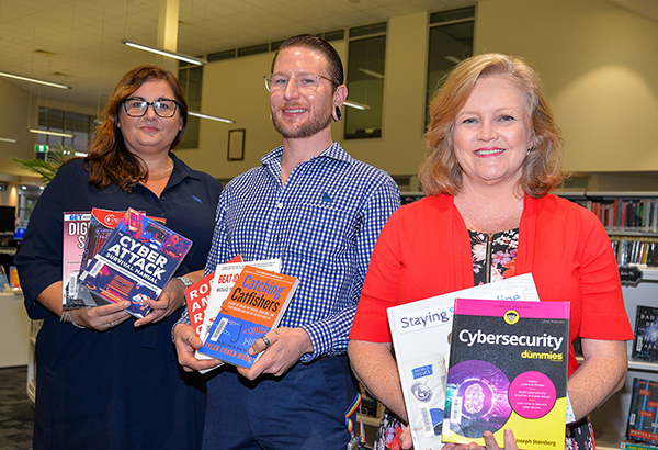 City Lifestyle Committee Chair Councillor Laurie Koranski (right) and Kelly Reed (far left) and Justin Armstrong from The Bank of Queensland’s Logan Central branch are inviting the community to learn more about protecting themselves from scams and frauds.