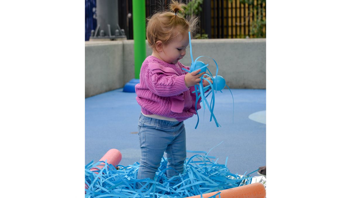 Hailey Ayton from Shailer Park takes part in one of the sensory activities available at the new The Frog Squad@the Splash Pad project at the Beenleigh Aquatic Centre.