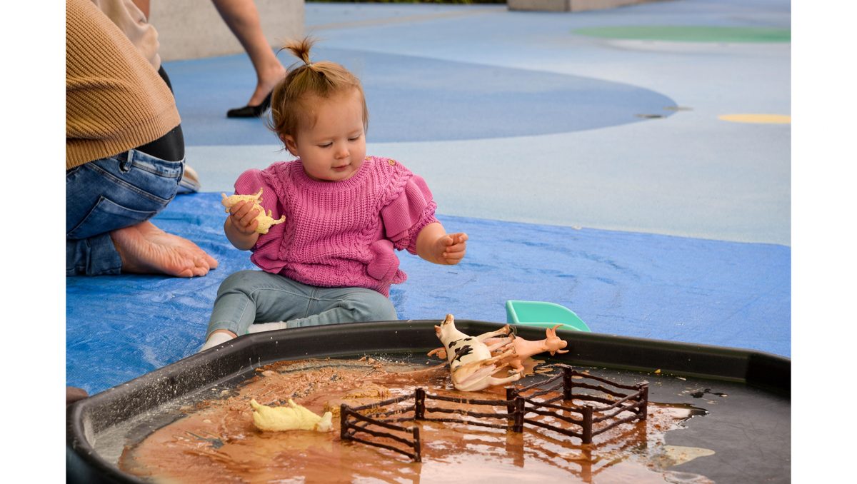 Hailey Ayton from Shailer Park enjoys some mud play as part of The Frog Squad program.