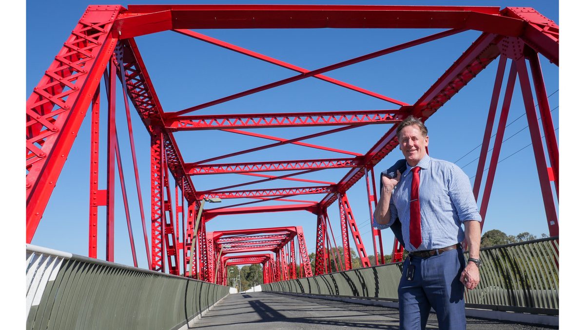 Mayor Darren Power, pictured on the iconic Red Bridge adjacent to the M1, says the City of Logan is well-placed to share its diverse experiences and cultural cuisines with the world.