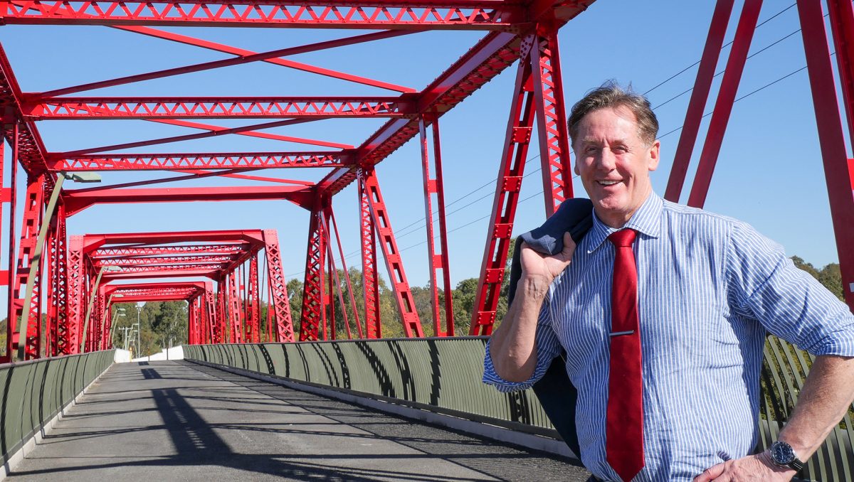 Mayor Darren Power, pictured on the iconic Red Bridge adjacent to the M1, says the City of Logan is well-placed to share its diverse experiences and cultural cuisines with the world.