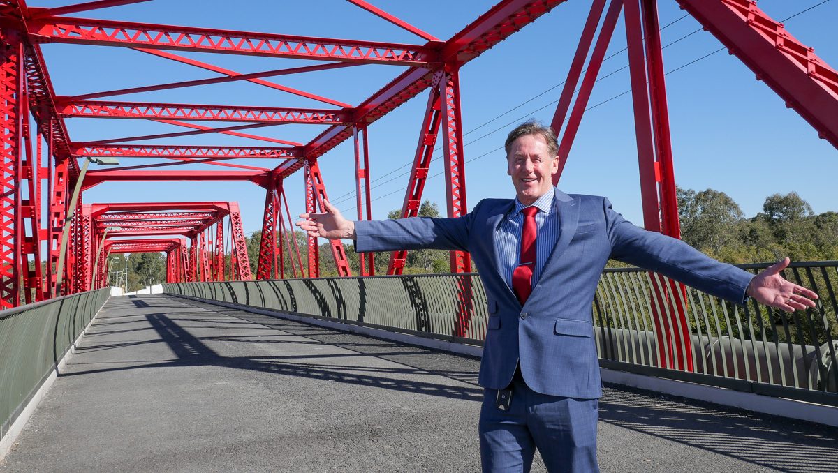 Mayor Darren Power, pictured on the iconic Red Bridge adjacent to the M1, says the City of Logan is well-placed to share its diverse experiences and cultural cuisines with the world.