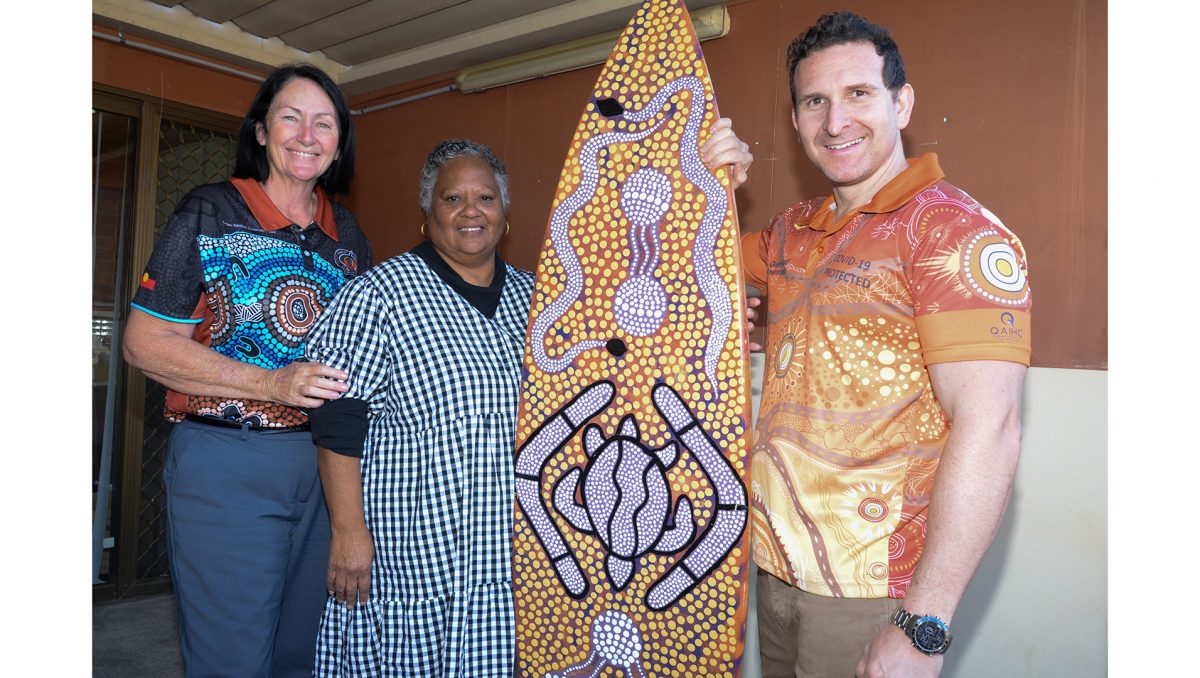 Logan City Councillor Teresa Lane (left), Logan District Aboriginal & Torres Strait Islander Corporation for Elders representative Aunty Leoni Lippitt and Cr Tony Hall with one of the prizes to be raffled at the Logan NAIDOC Family Fun Day.