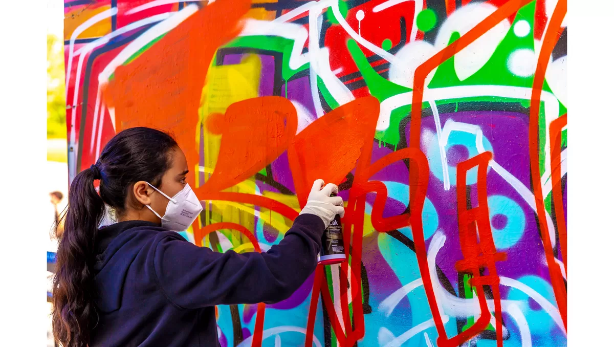 The foundations of graffiti and street art will be taught to participants like Raela Tekii at a three-day KRANK program workshop.