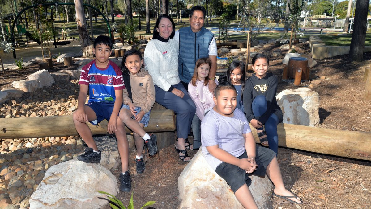 An image in the park of Division 2 Councillor Teresa Lane (left) in Kingston’s Eridani Park with local resident Mary Pauga and her grandchildren (from left) Onyx Pauga, 14, Jasper Pauga, 8, Jade Harper, 10, Beast Tinania, 7, Boss Tinania, 5, and Beauty Tinania, 9.