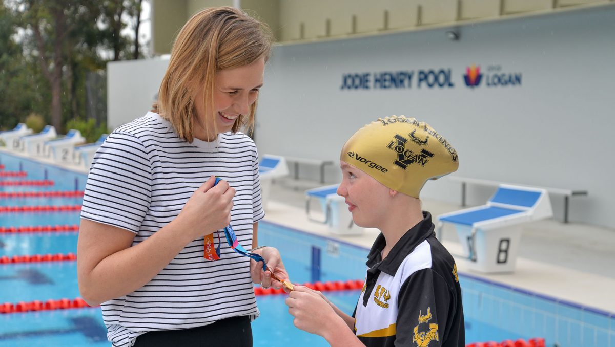 Swimmer Jodie Henry, who grew up in Springwood, with Logan Vikings member Maddee Clarke at the reopening of Jodie Henry Pool at Underwood last year.