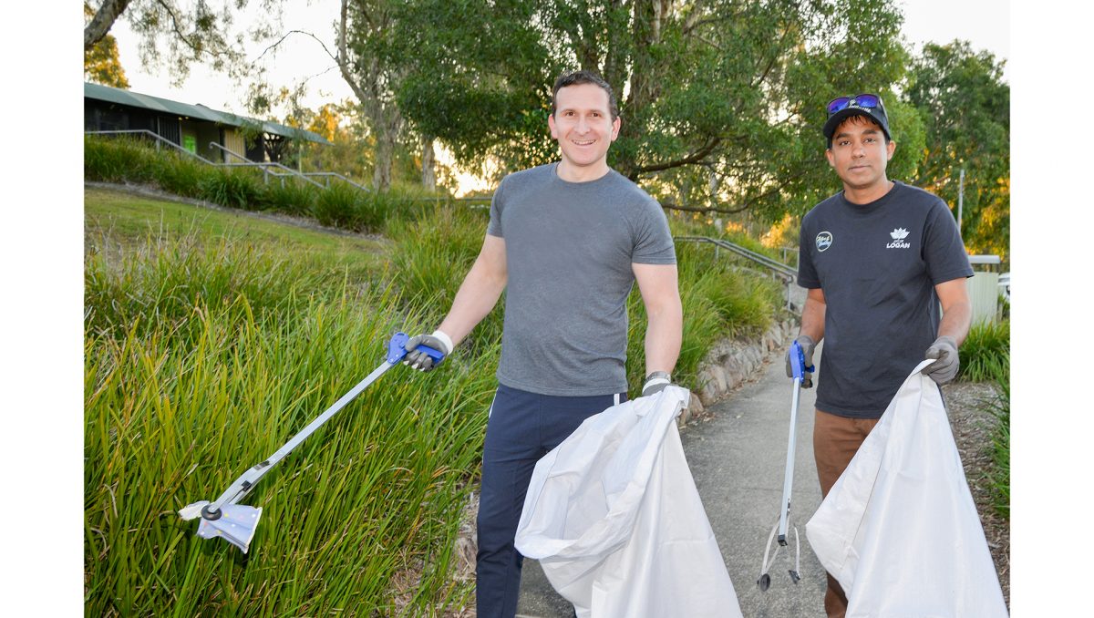 Lifestyle Chair Councillor Tony Hall (left) and Sameer Punde, from WorkEco, practise plogging which is picking up litter while jogging. It is a new and free activity in Logan City Council’s Active & Healthy program.