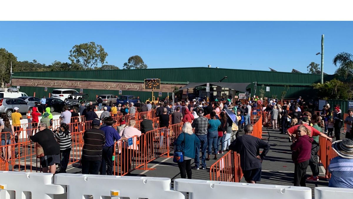 A crowd waiting to access the popular Logan Recycling Market.