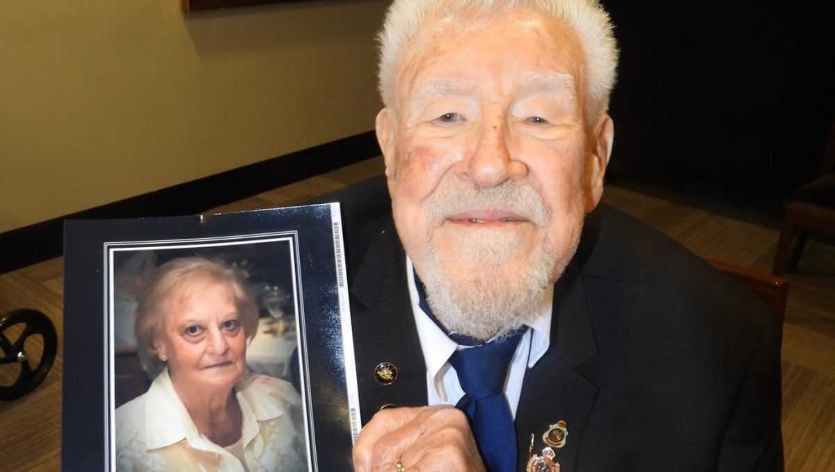 Brian Harris with a photo of late wife Myra, the inspiration behind Brian;s generous donation to Logan schools.