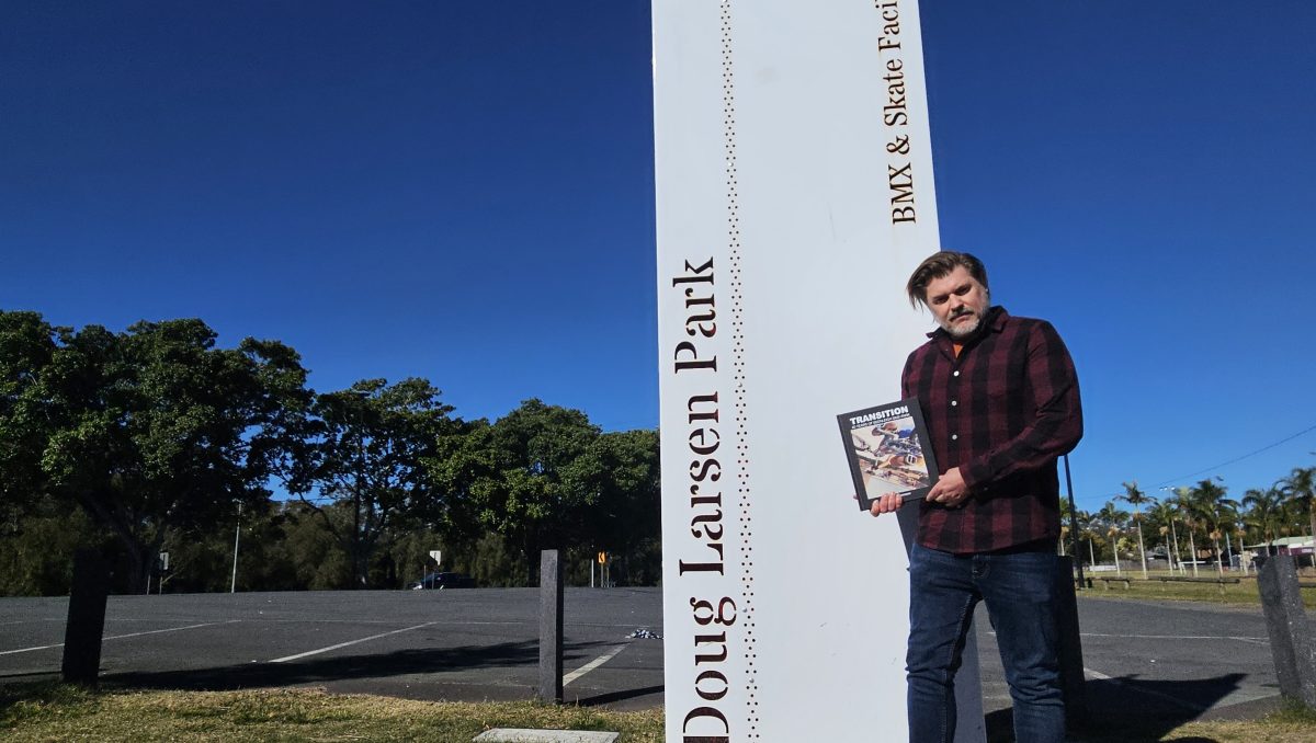 Ross Lavender with his book which explores the history of BMX in Beenleigh