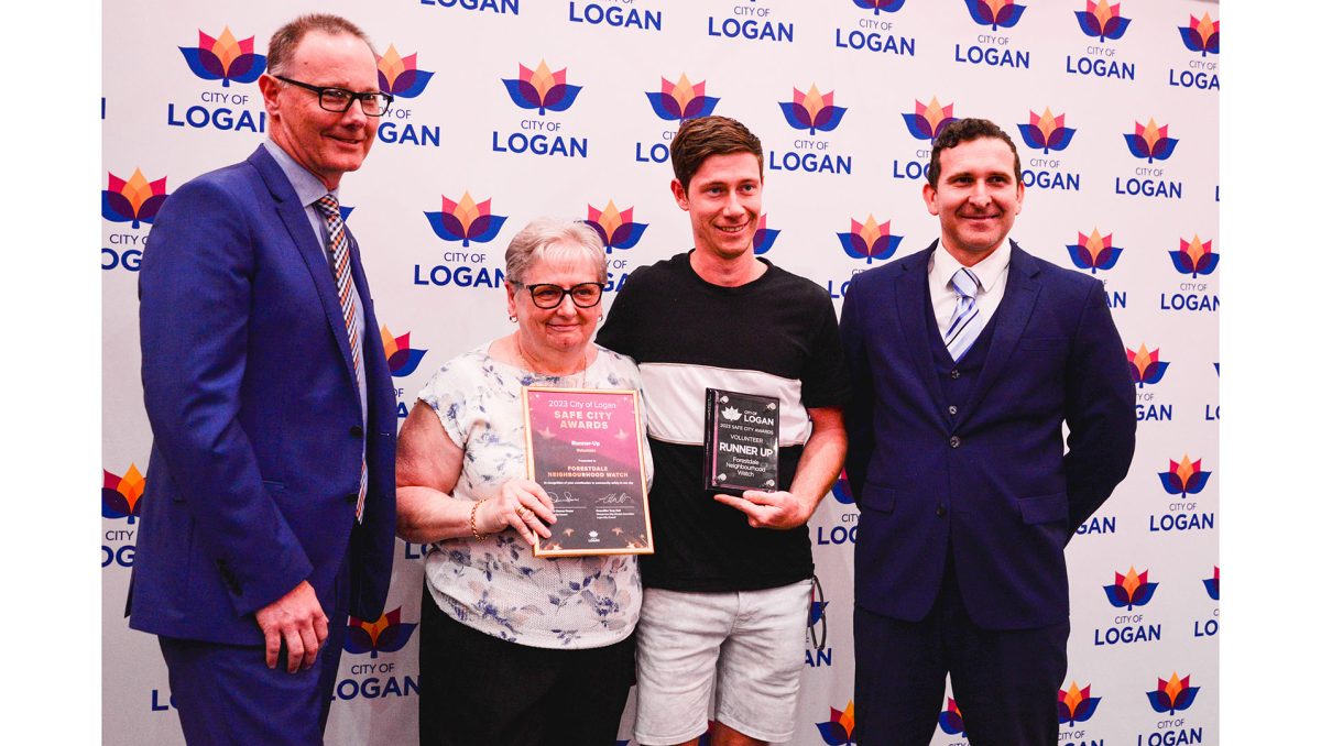 Community and Lifestyle director Brad White (left) and Cr Tony Hall (far right) with Forestdale Neighbourhood Watch representatives Lynn Whittingham and Clay Yates.