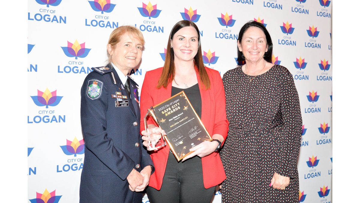 Yarrabilba community champion Melinda Hartley is awarded the Stan Wells Award by Logan District Chief Superintendent Mel Adams (left) and Division 2 Councillor Teresa Lane at the 2023 City of Logan Safe City Awards for the work she has done locally.