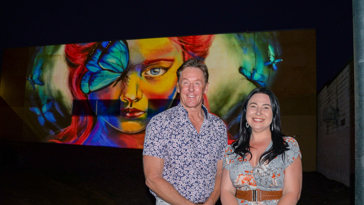 Mayor Darren Power and Division 3 Councillor Mindy Russell enjoy the bright new lighting projection in Slacks Creek.