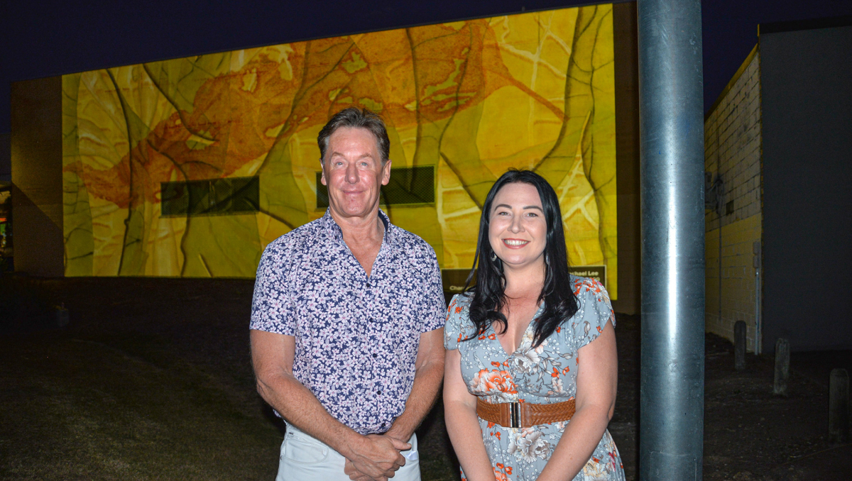 Mayor Darren Power and Division 3 Councillor Mindy Russell, pictured with artist Rachael Lee's piece 'Reflections', enjoy the bright new lighting projection in Slacks Creek.