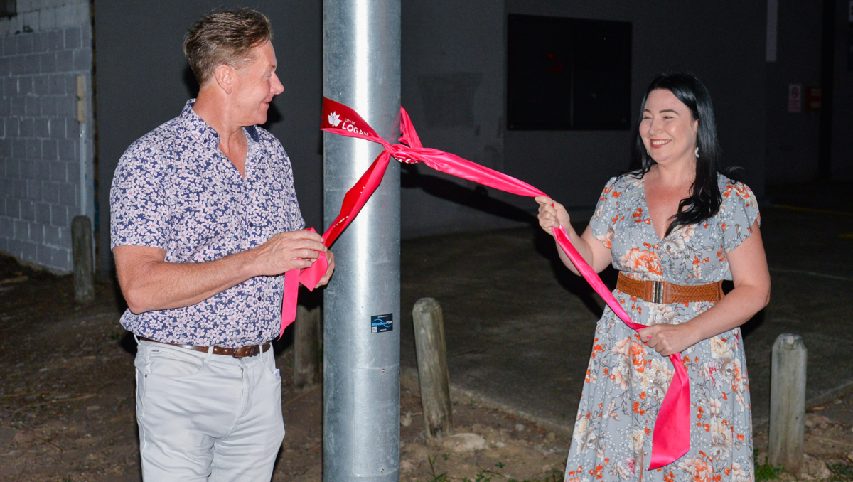 Mayor Darren Power and Division 3 Councillor Mindy Russell launch the new lighting projection in Slacks Creek.